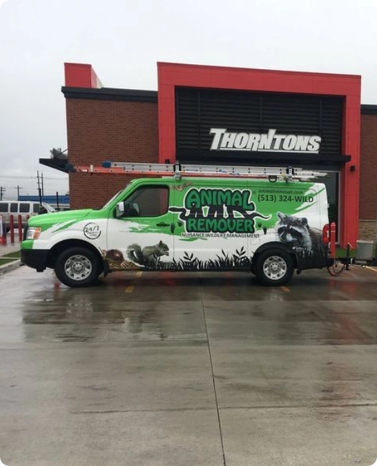 Animal Remover van in front of gas station