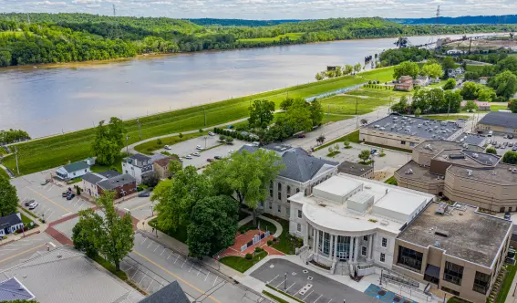 Aerial view of the Dearborn County Courthouse and surrounding properties along the Ohio River in Lawrenceburg, Southeastern Indiana. Animal Remover serves homeowners and businesses across Dearborn and Ohio counties.