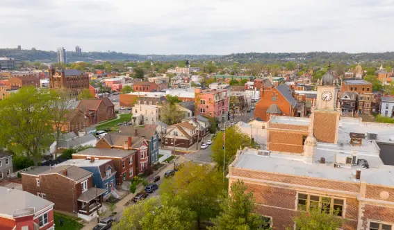 Aerial view of residential rooftops and the historic Campbell County Courthouse in Newport, Northern Kentucky. Animal Remover offers humane animal trapping and exclusion across Boone, Kenton, and Campbell counties.