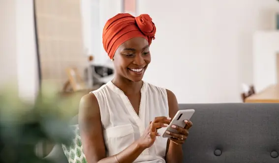 Woman using phone to connect with Animal Remover on social media